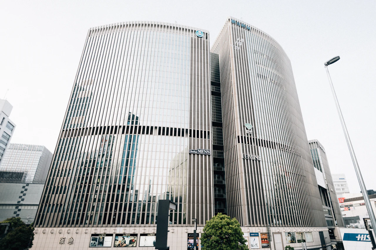 Modern glass office buildings against a cloudy sky